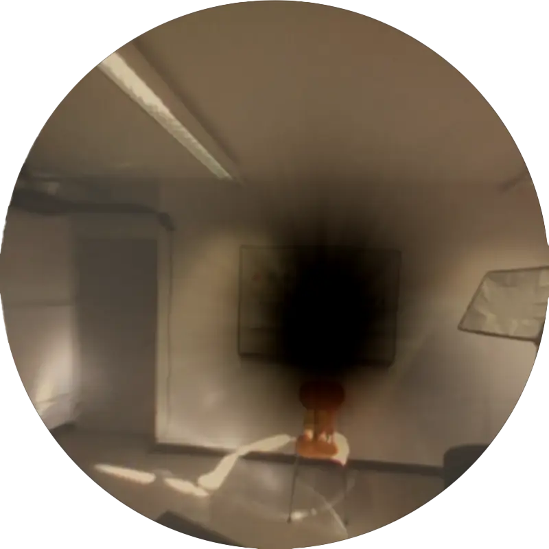 looking at a wooden chair in front of a whiteboard with posterior subcapsular cataracts simulated in augmented reality